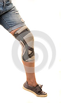 Close up of a woman leg with knee orthosis