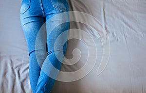 Close up of woman legs with blue jeans,Feet and stretch lazily