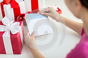 Close up of woman with letter and presents