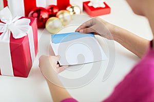 Close up of woman with letter and presents