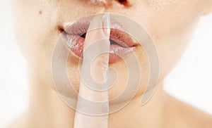 Close up of a woman lips with finger