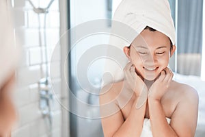 Close up woman looking her face in the mirror with smiling after bath, health care and beauty