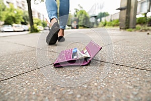 Close-up Of Woman Losing His Wallet