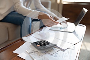 Close up of woman manage household finances at home