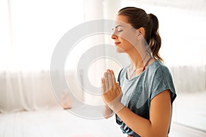 Close up of woman meditating at yoga studio