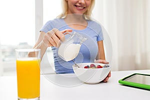 Close up of woman with milk jug eating breakfast