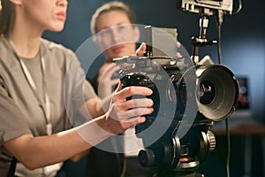 Close Up of Woman Operating Digital Camera