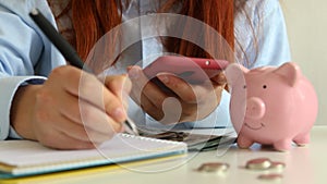 Close up of woman paying bills calculating household finances or taxes, female manage home family expenditures, using