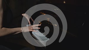 Close-up of woman playing piano. Media. Elegant woman plays piano in accelerated rhythm. Accelerated video of woman