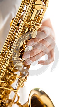 Close up woman playing saxophone isolated on white studio background