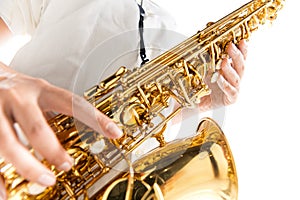 Close up woman playing saxophone isolated on white studio background