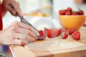 Close Up Of Woman Preparing Fruit Salad