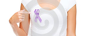 Close up of woman with purple awareness ribbon