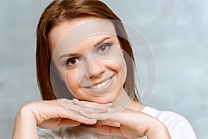 Close up of woman putting her head on hands