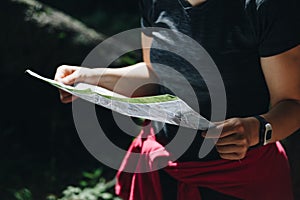 Close-up of a woman reading map orientation concept