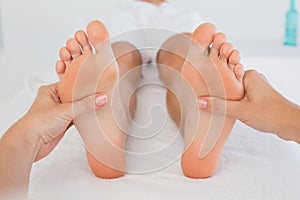 Close-up of a woman receiving foot massage