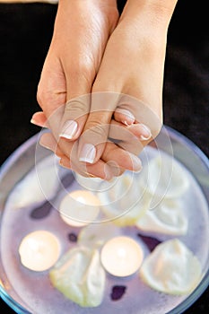 Close-up of woman receiving heat therapy on hand