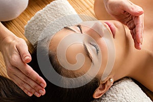 Close up of woman at reiki session. photo