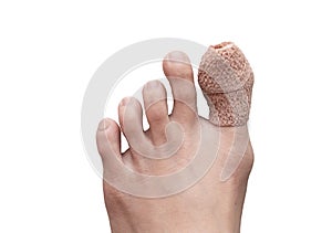 Close up of woman right foot with a wounded on big toe. Isolated on white background. Accident and health care concept