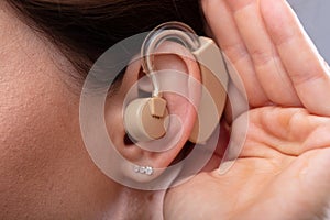 Close-up Of A Woman`s Ear With Hearing Aid photo