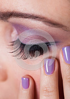 Close-up Of Woman's Eye With Purple Eyeshadow