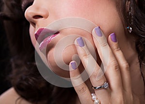 Close-up Of Woman's Hand Wearing Diamond Ring photo