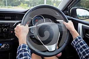 Close-up Of Woman's Hand Holding Steering Wheel