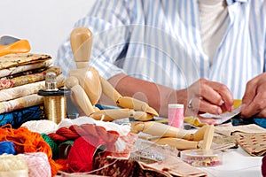 Close up of woman`s hand sewing patchwork
