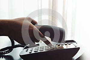 Close-up of Woman`s Hand using a Telephone in House or Hotel nea