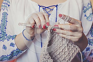 Close-up of woman`s hands knitting