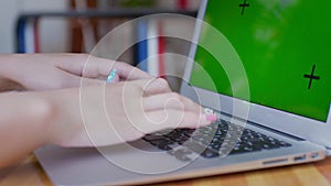 Close-up of a woman's hands typing a laptop keyboard. Business woman typing on laptop keyboard