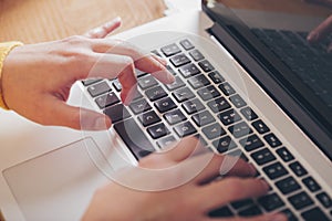 Close up of woman`s hands using computer keyboard. Enterprising woman, use of technology photo