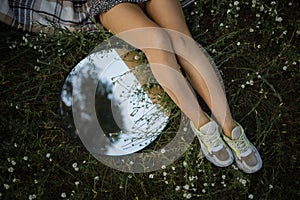 Close Up Of A Woman`s Legs Lying On The Grass