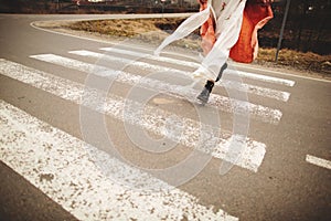 Close up on woman`s legs on the road. Woman running