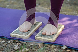 Close up of woman's legs after standing on sadhu board