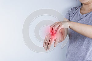 Close up woman scratching her itchy hand with allergy rash by hand on white background with red spot. Healthcare, skin problem and