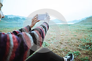 Close up a woman selfie with smartphone after wake up