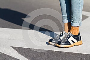 Close up of woman shoes standing on the street