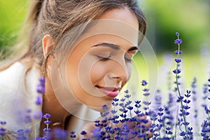 Close up of woman smelling lavender flowers