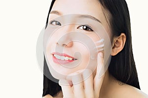 Close up woman is smiling skin beauty and health and apply white cream on face, for spa products and make up.