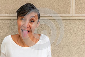 Close-up of woman sticking out her tongue