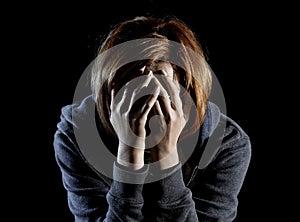 Close up woman suffering depression and stress alone in pain and grief