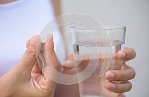 Close up of woman taking in pill, Medicine, health care