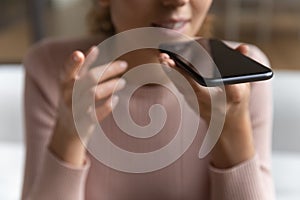 Close up of woman talk on loudspeaker on cellphone