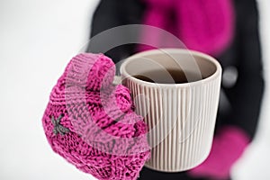 Close up of woman with tea mug outdoors in winter