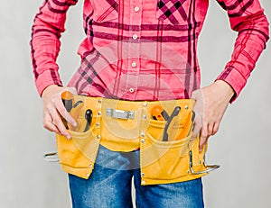 Close-up woman with tool belt