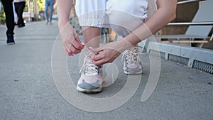 Close up of woman tying sport shoe laces preparing to run or training