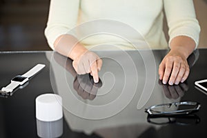 Close up of woman using black interactive panel