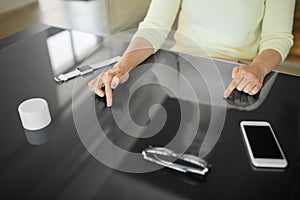 Close up of woman using black interactive panel