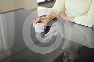 Close up of woman using black interactive panel